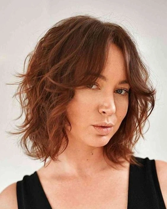 choppy medium layered hair Coppery Shag Bob With Soft Messy Ends