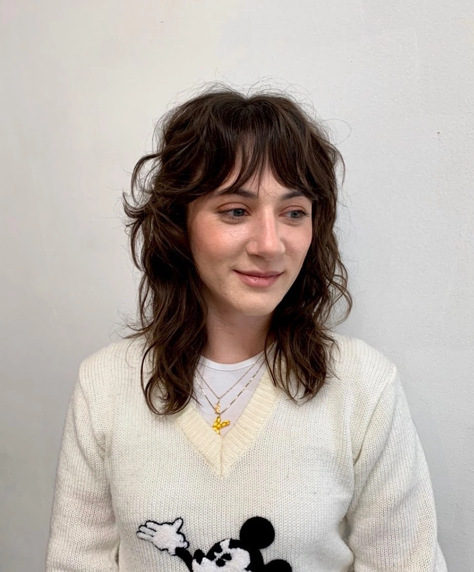 choppy medium layered hair Soft Brunette Shag With Cozy Knit Styling