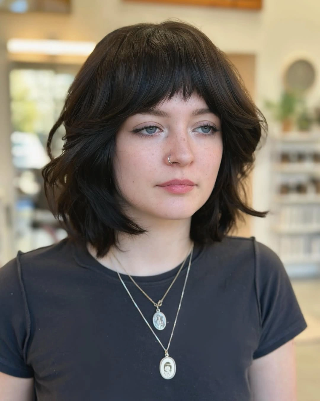 choppy medium layered hair Dark Rounded Bob With Baby Bangs