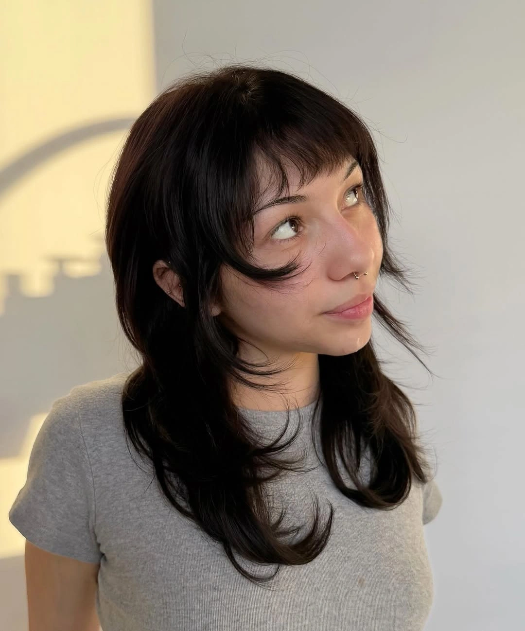 choppy medium layered hair Glossy Black Layers With Whisper Bangs
