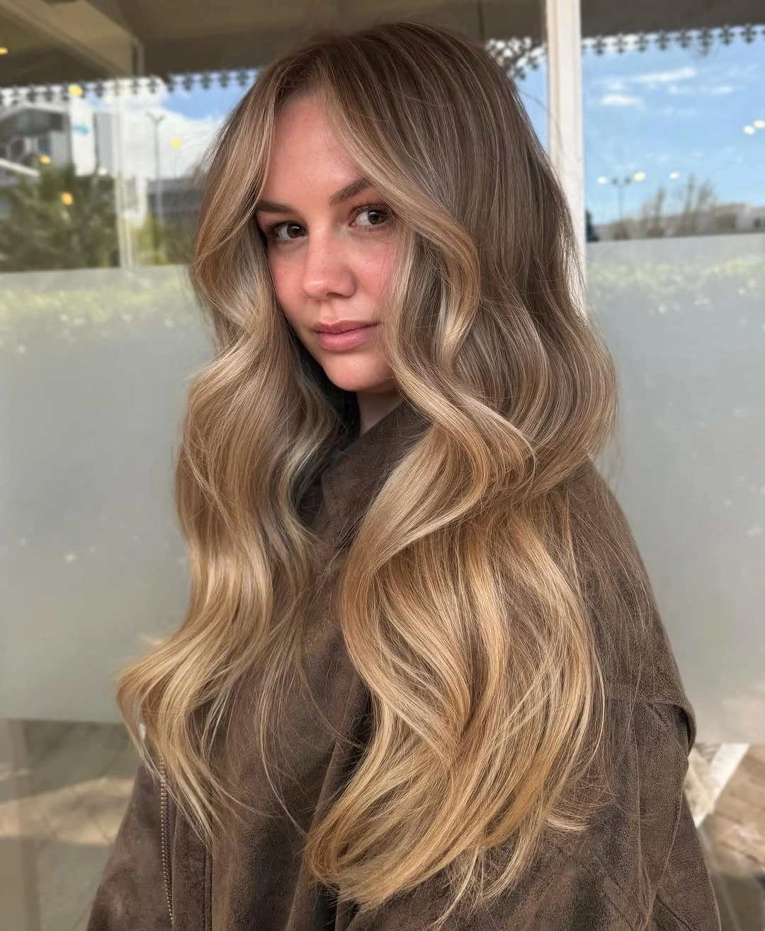 dirty blonde hair color Buttery Blonde Ends With Soft Bronde Roots