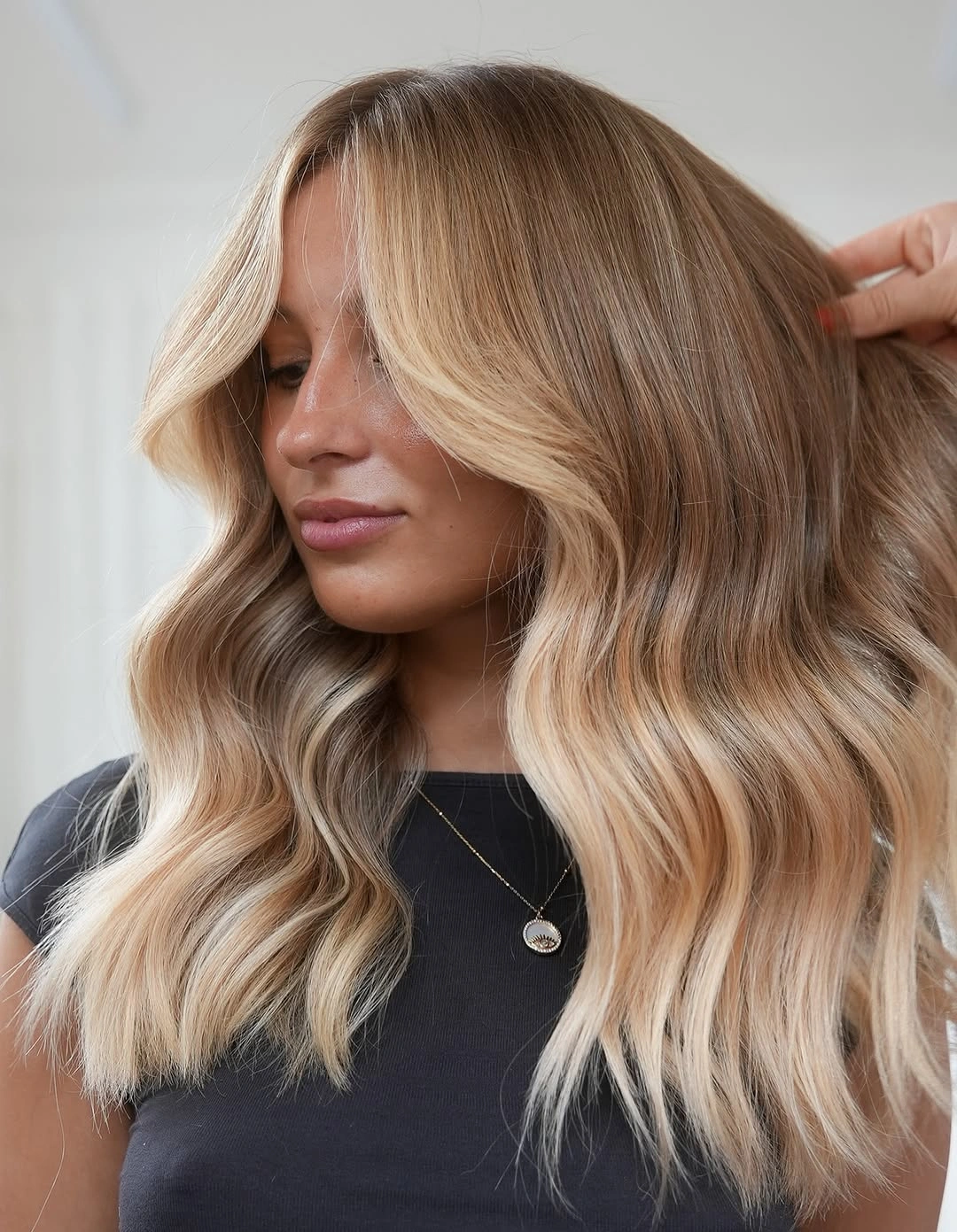 dirty blonde hair color Soft Peachy-Beige Blonde With Face-Framing Waves