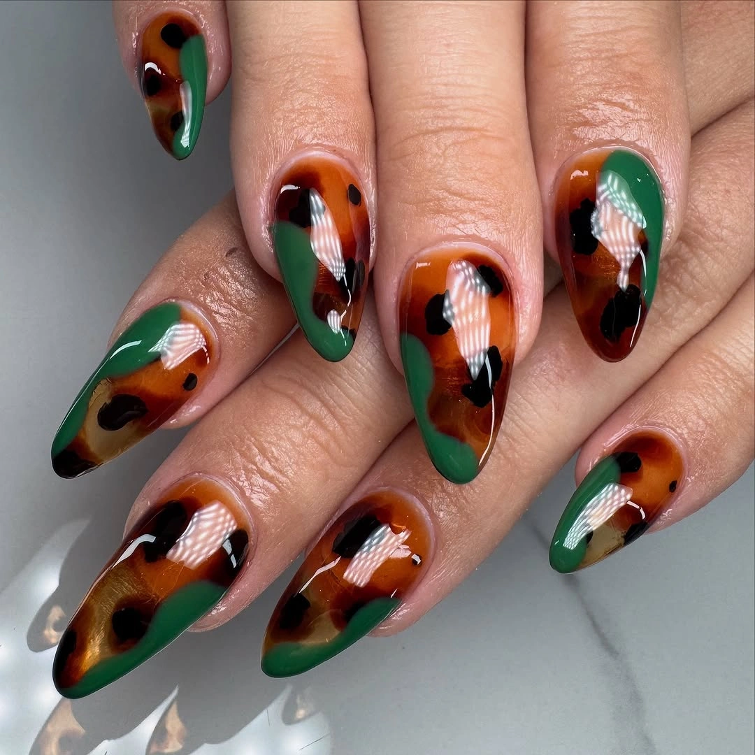 fall almond nails 2026 Green And Amber Almond Nails With Leaf Art