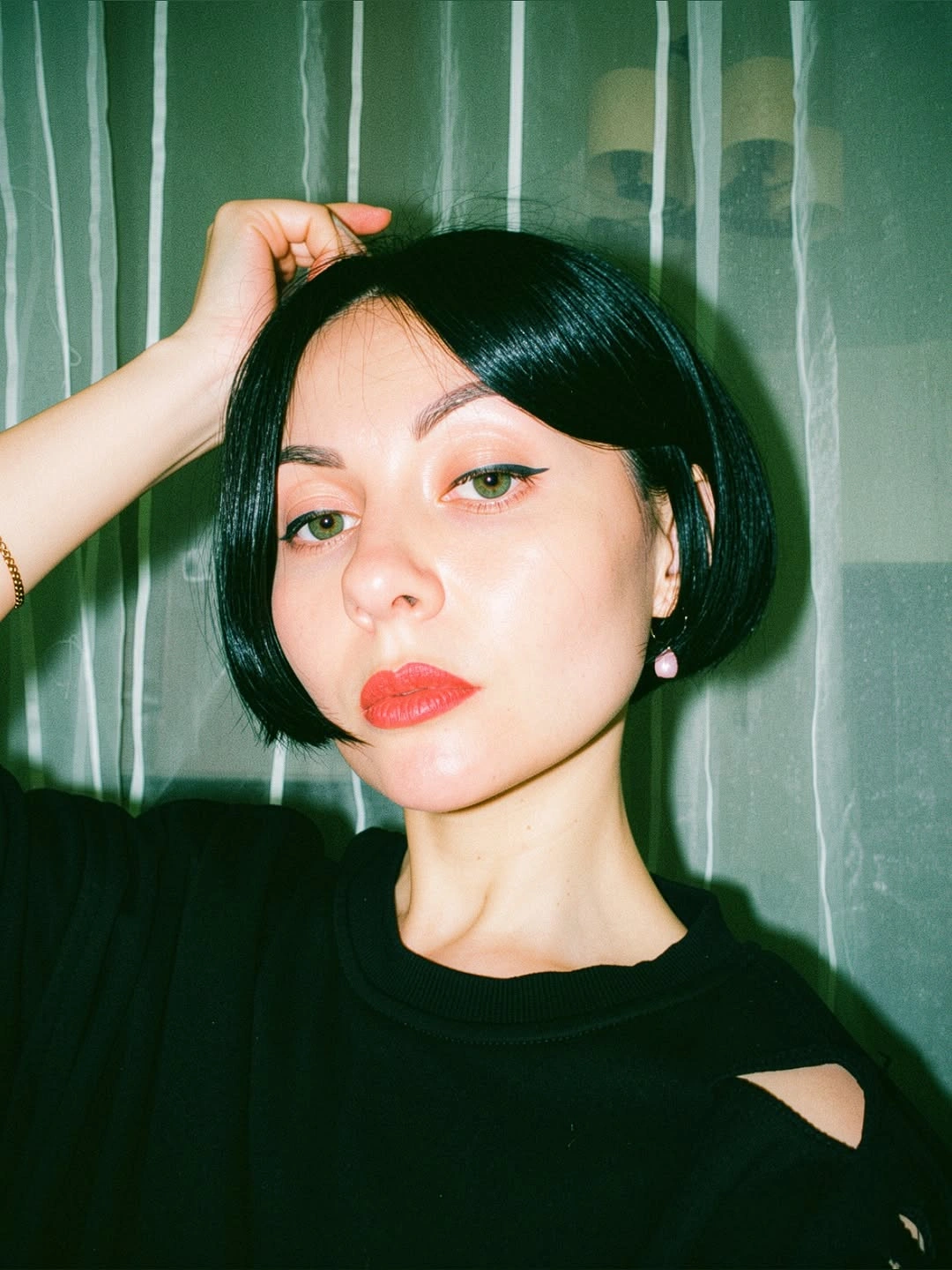fall bob haircut ideas 2026 Ink-Black Micro Bob With a Deep Side Part