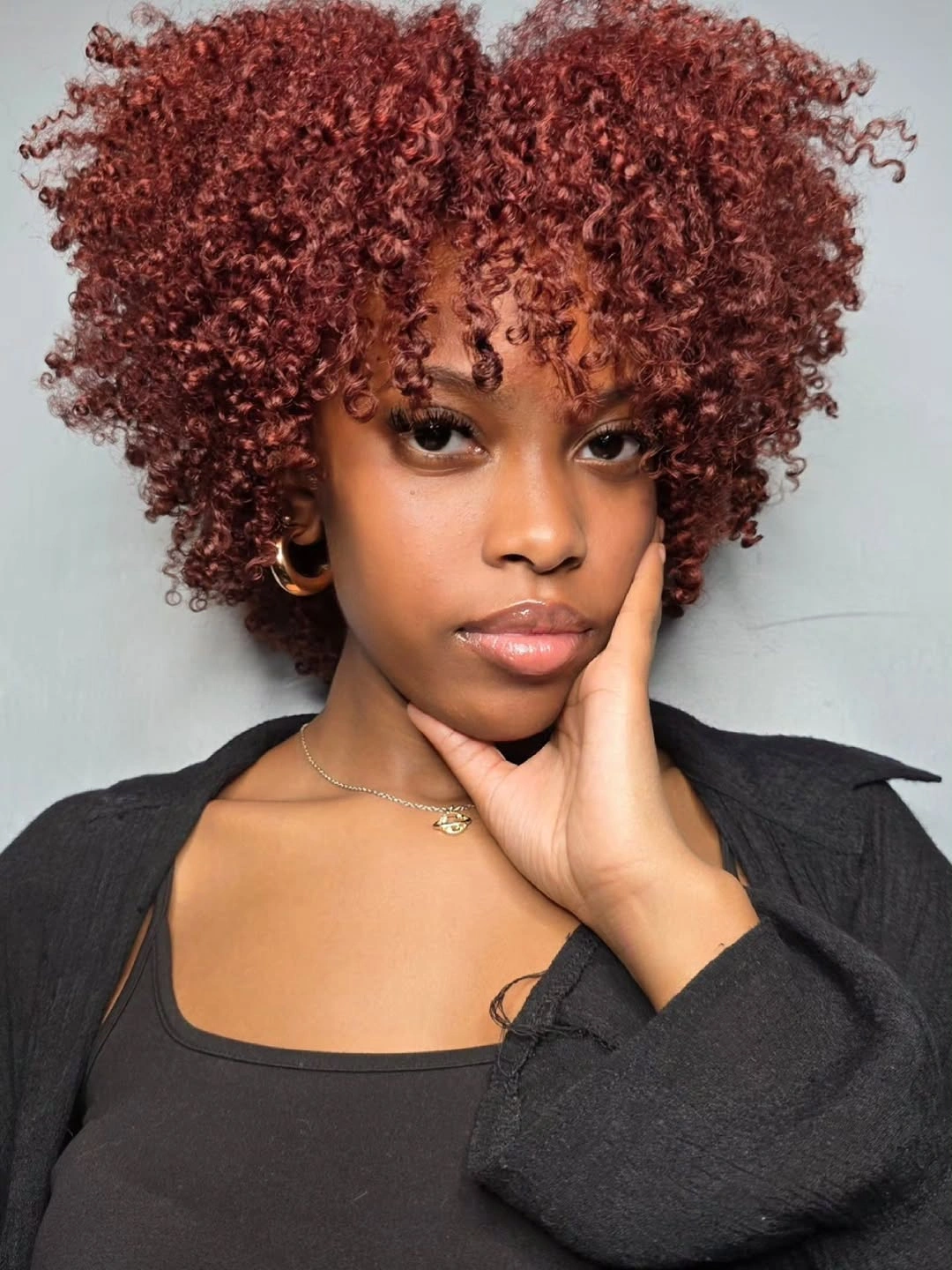 fall hair colors for black women 2026 Cherry Auburn Curls With Soft Cool-Girl Shape
