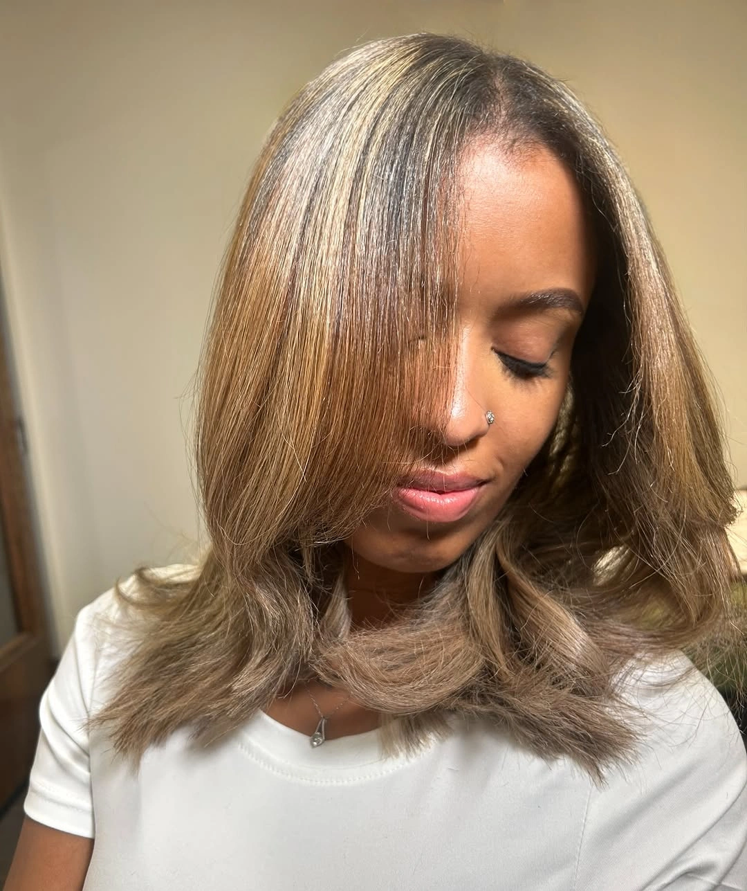 fall hair colors for black women 2026 Smoky Blonde Layers With a Soft Neutral Glow