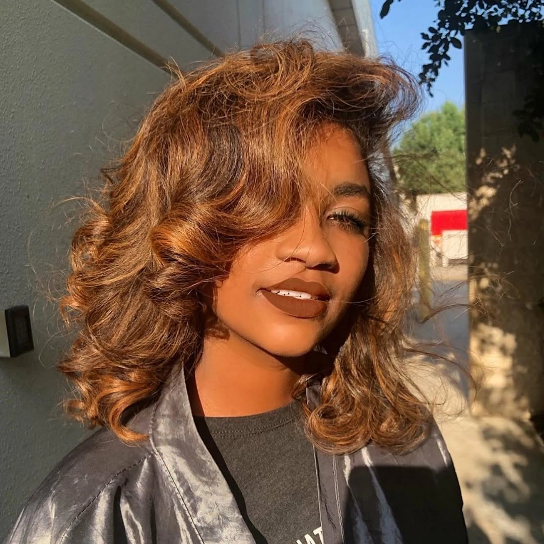 fall hair colors for black women 2026 Golden Copper Waves With Sunlit Fall Drama
