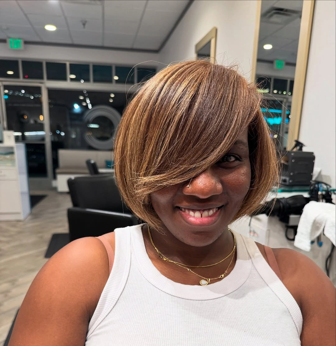 fall hair colors for black women 2026 Honey Blonde Asymmetrical Bob With Bright Face Framing