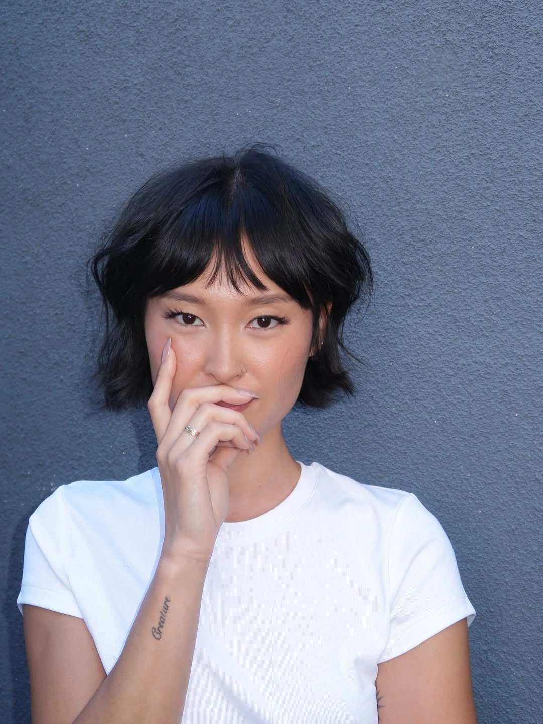fall haircuts for women 2026 Soft Wavy Bob With Wispy Curtain Bangs