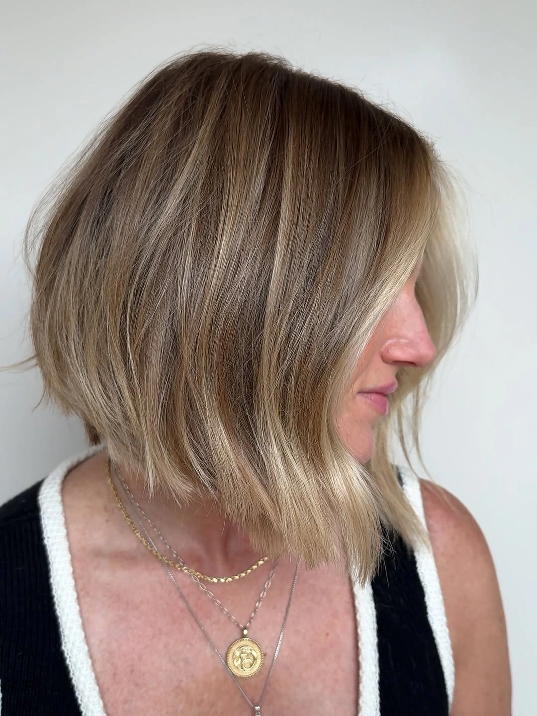 fall haircuts for women 2026 Blonde Angled Lob With Soft Face-Framing Pieces