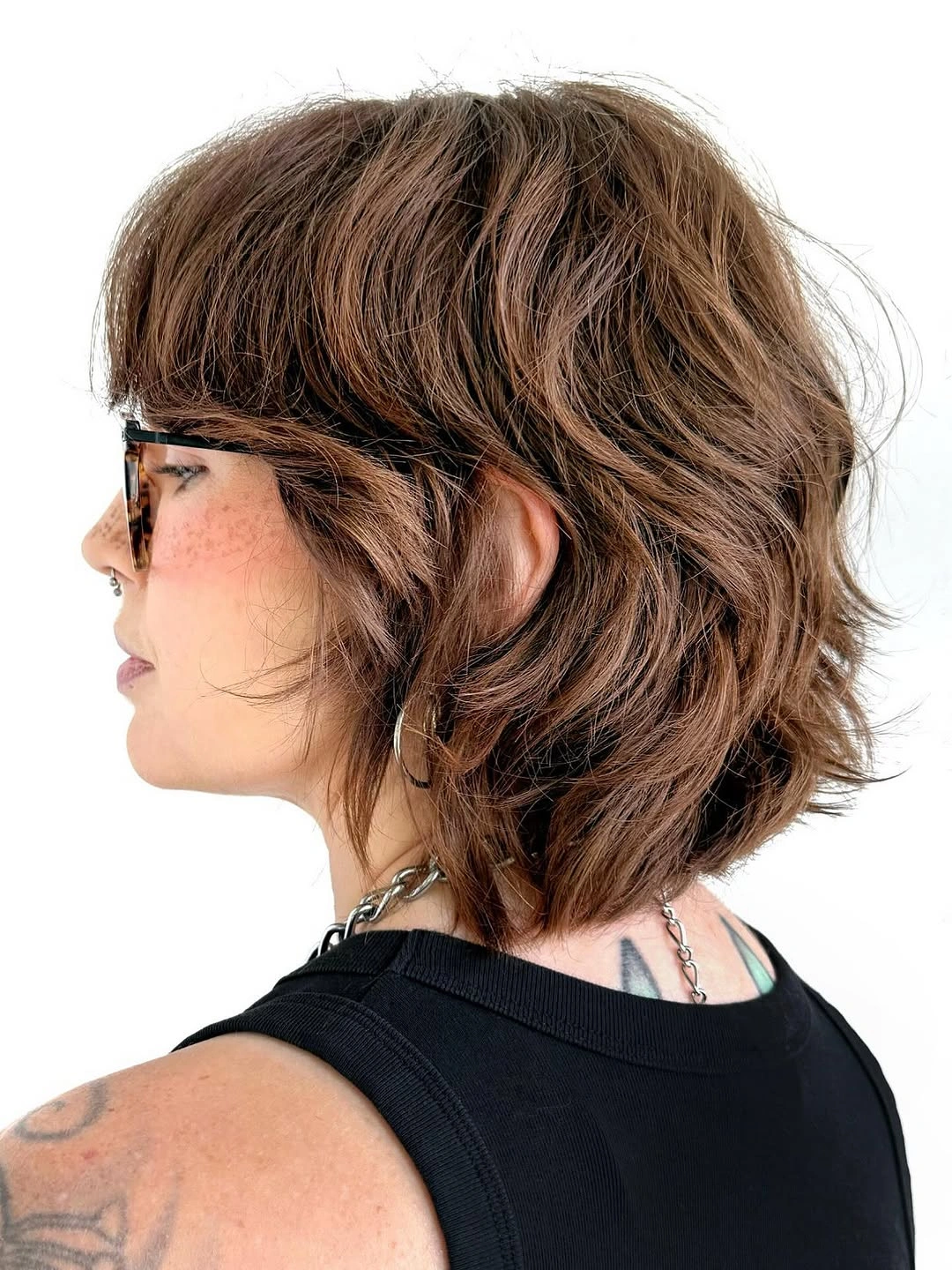 fall haircuts for women 2026 Textured Brunette Shag With Tousled Volume