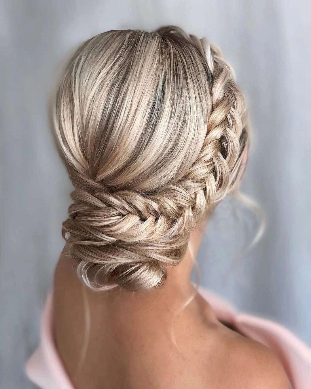 fall hairstyles 2026 Soft Blonde Braided Low Bun
