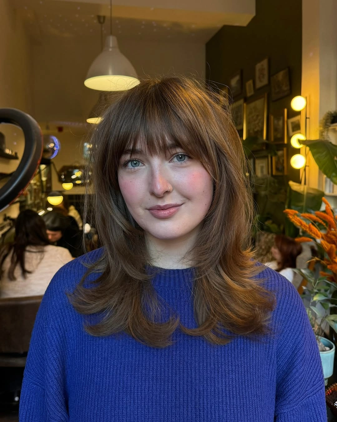 fall hairstyles 2026 Soft Brunette Blowout With Full Bangs