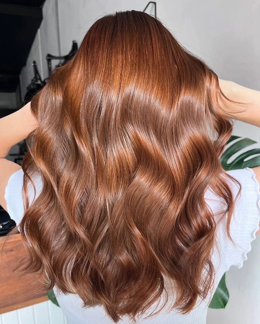 fall hairstyles for long hair 2026 Glossy Cinnamon Waves With a Soft Redhead Glow
