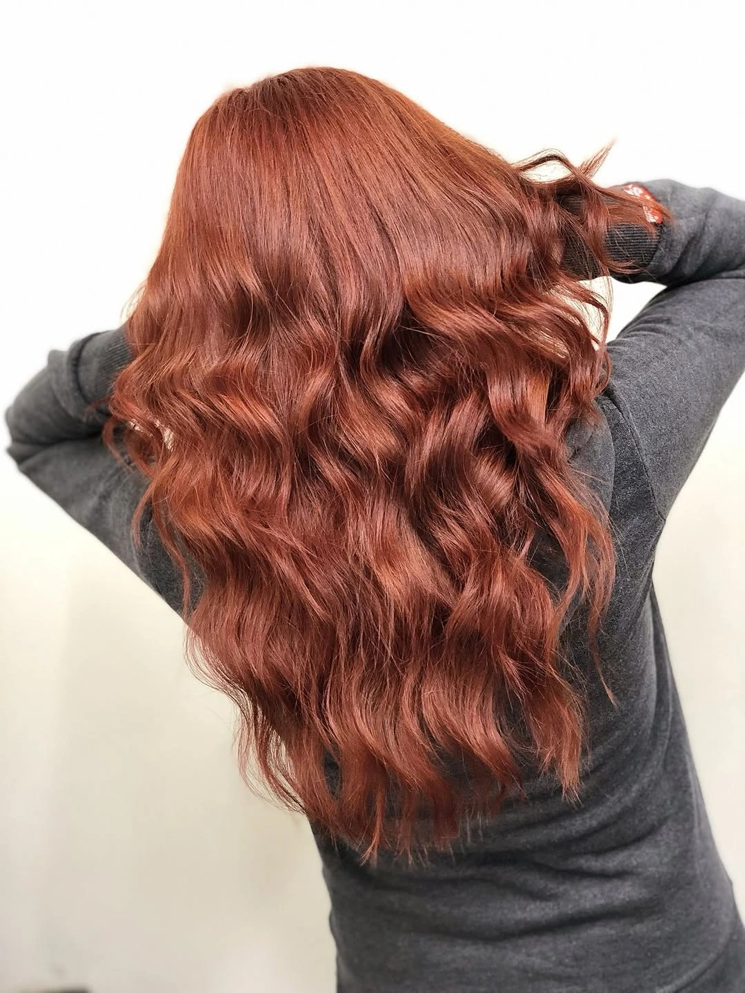 fall hairstyles for long hair 2026 Soft Auburn Waves With Cozy Sweater Energy