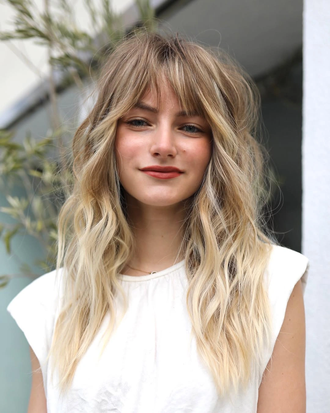 fall hairstyles for long hair 2026 Soft Blonde Waves With Airy French-Girl Bangs