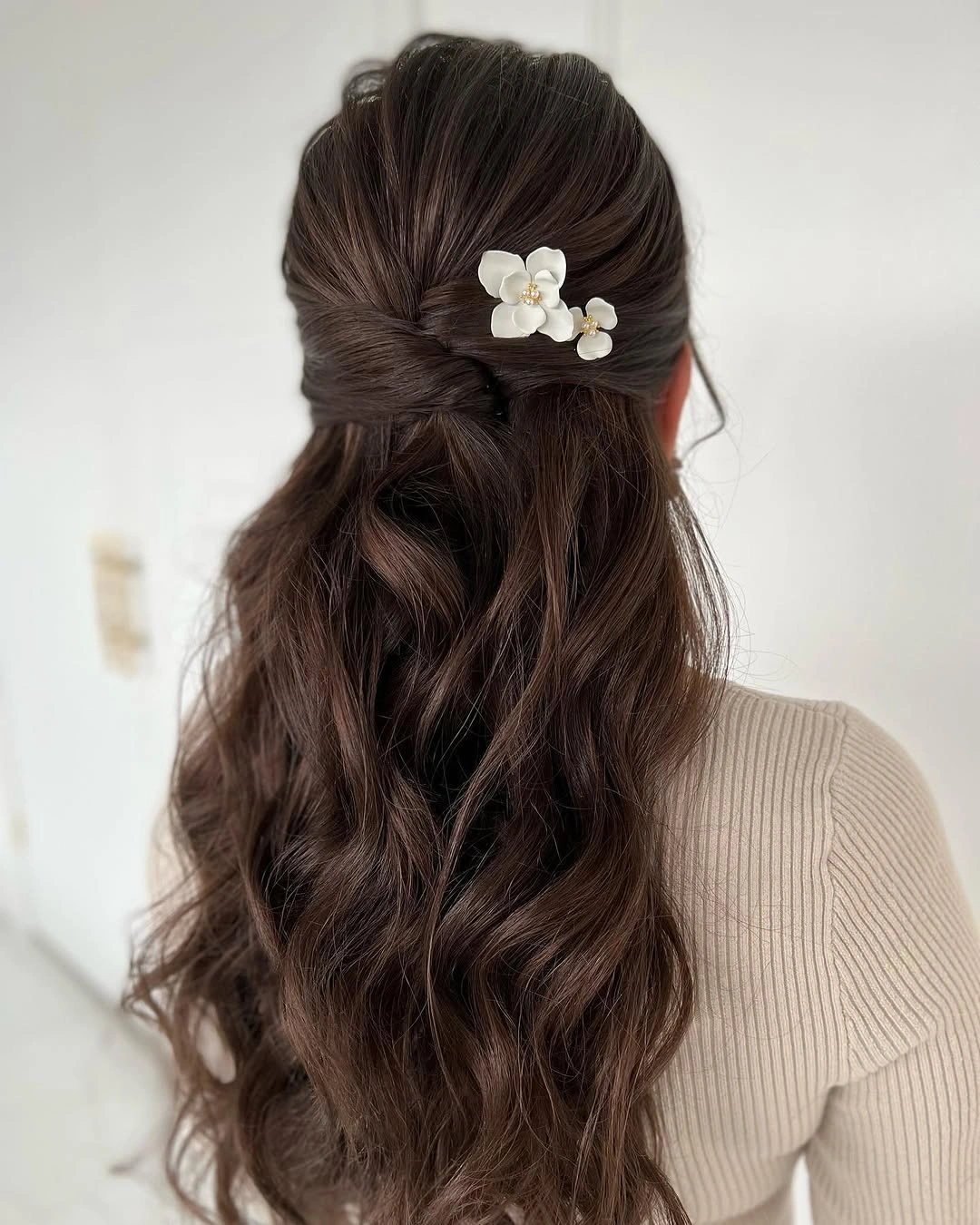 fall hairstyles for long hair 2026 Brunette Half-Up Waves With Tiny Floral Pins