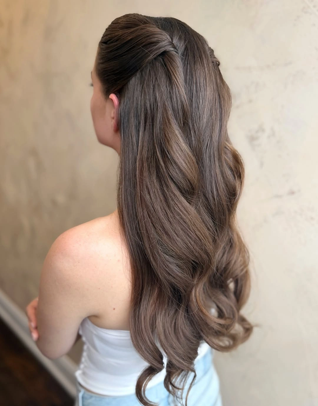 fall hairstyles for long hair 2026 Half-Up Brunette Waves With a Soft Twist