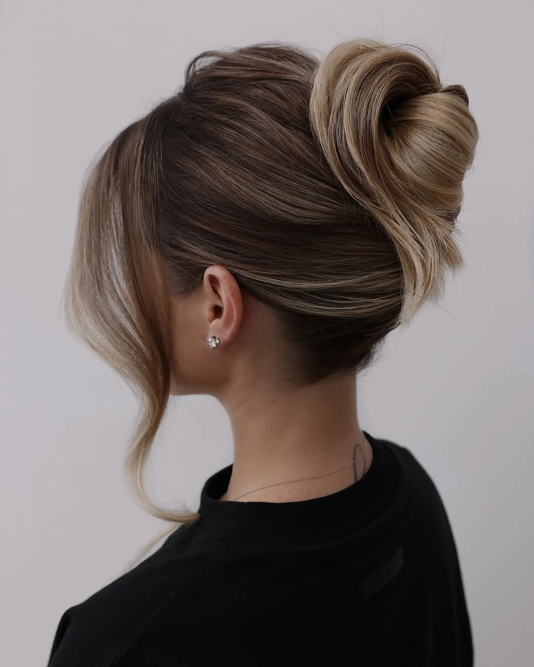 fall hairstyles for office 2026 Blonde-Front Twist Bun With Clean Business Polish