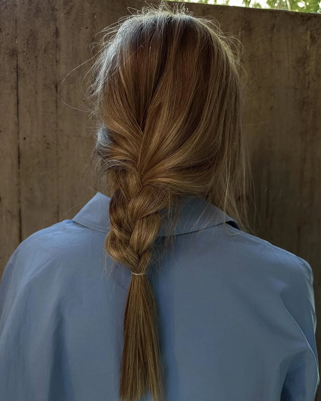 fall hairstyles for office 2026 Loose Low Braid Pony With Blue Shirt Ease
