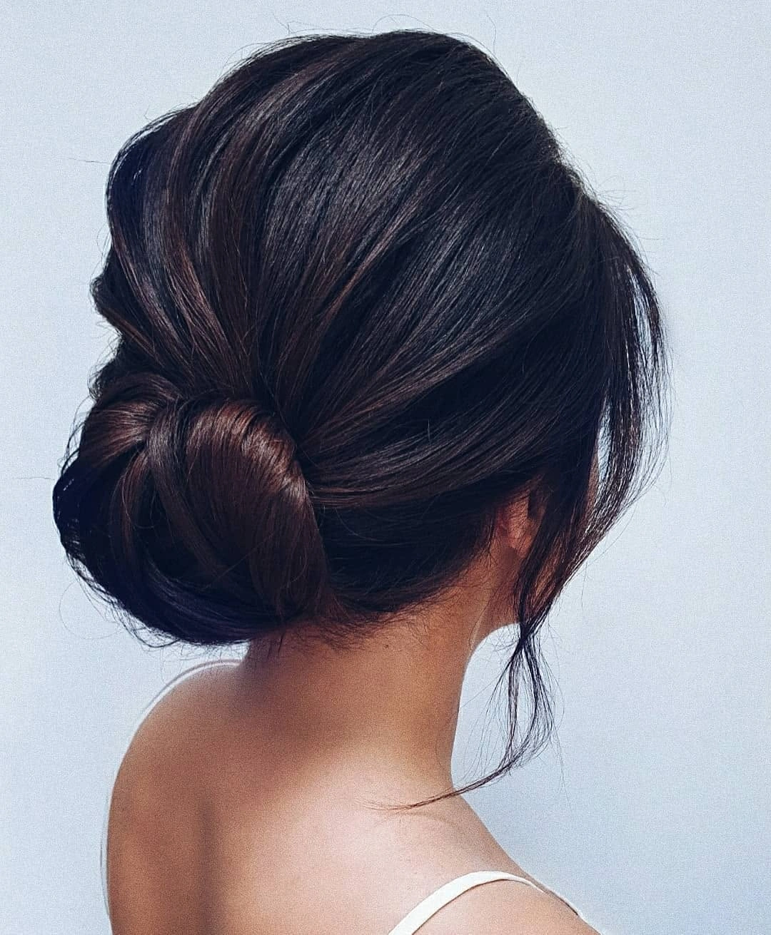fall hairstyles for office 2026 Glossy Low Bun With Quiet Luxury Shine