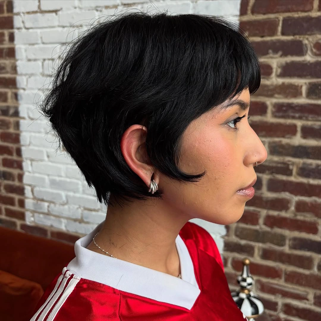 fall hairstyles for short hair 2026 Rounded Black Pixie With Sporty Red Contrast