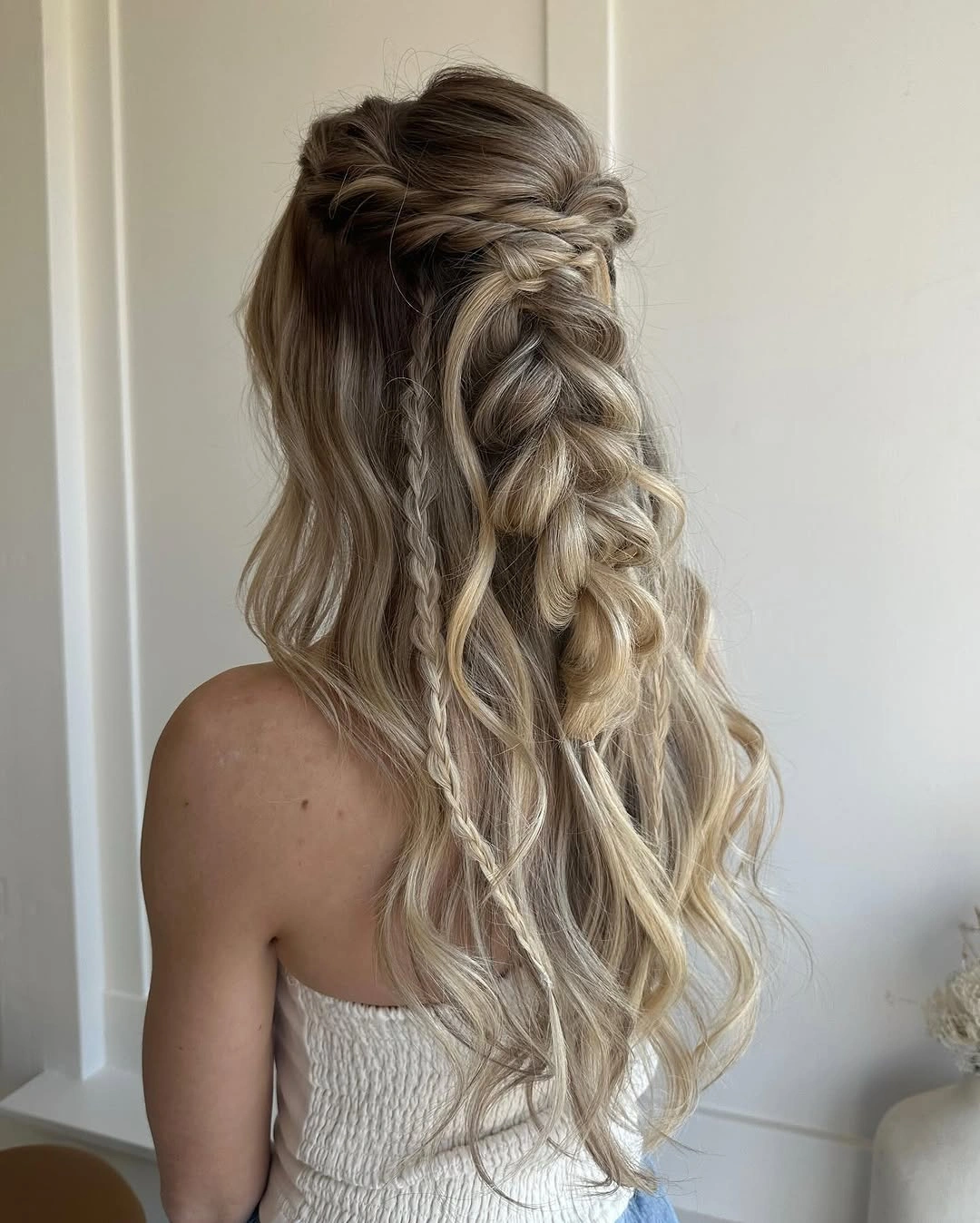 fall hairstyles for wedding guests 2026 Boho Blonde Braids With Loose Medium Waves