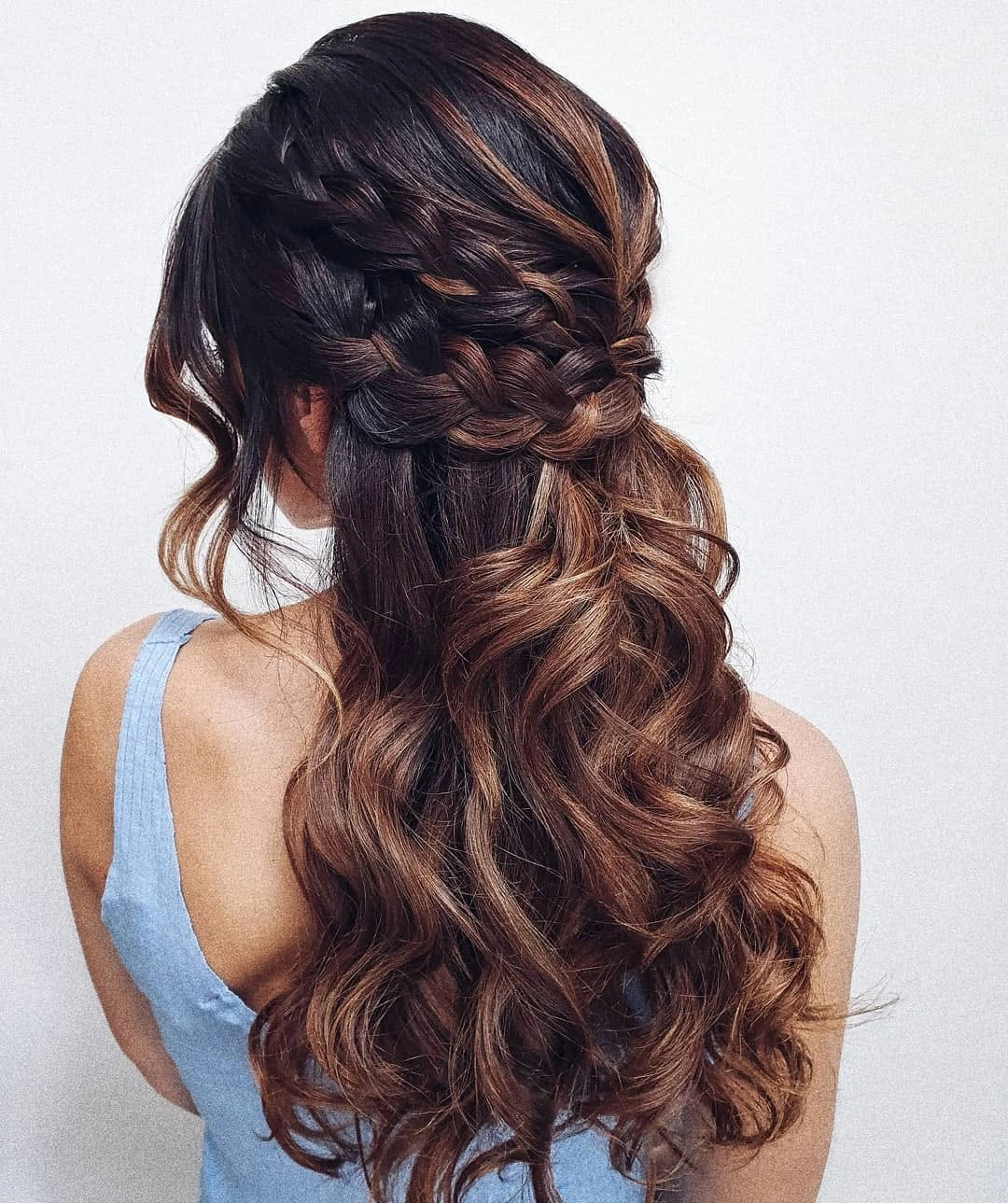fall hairstyles for wedding guests 2026 Copper-Brown Braided Half-Up Curls With A Soft Blue Dress