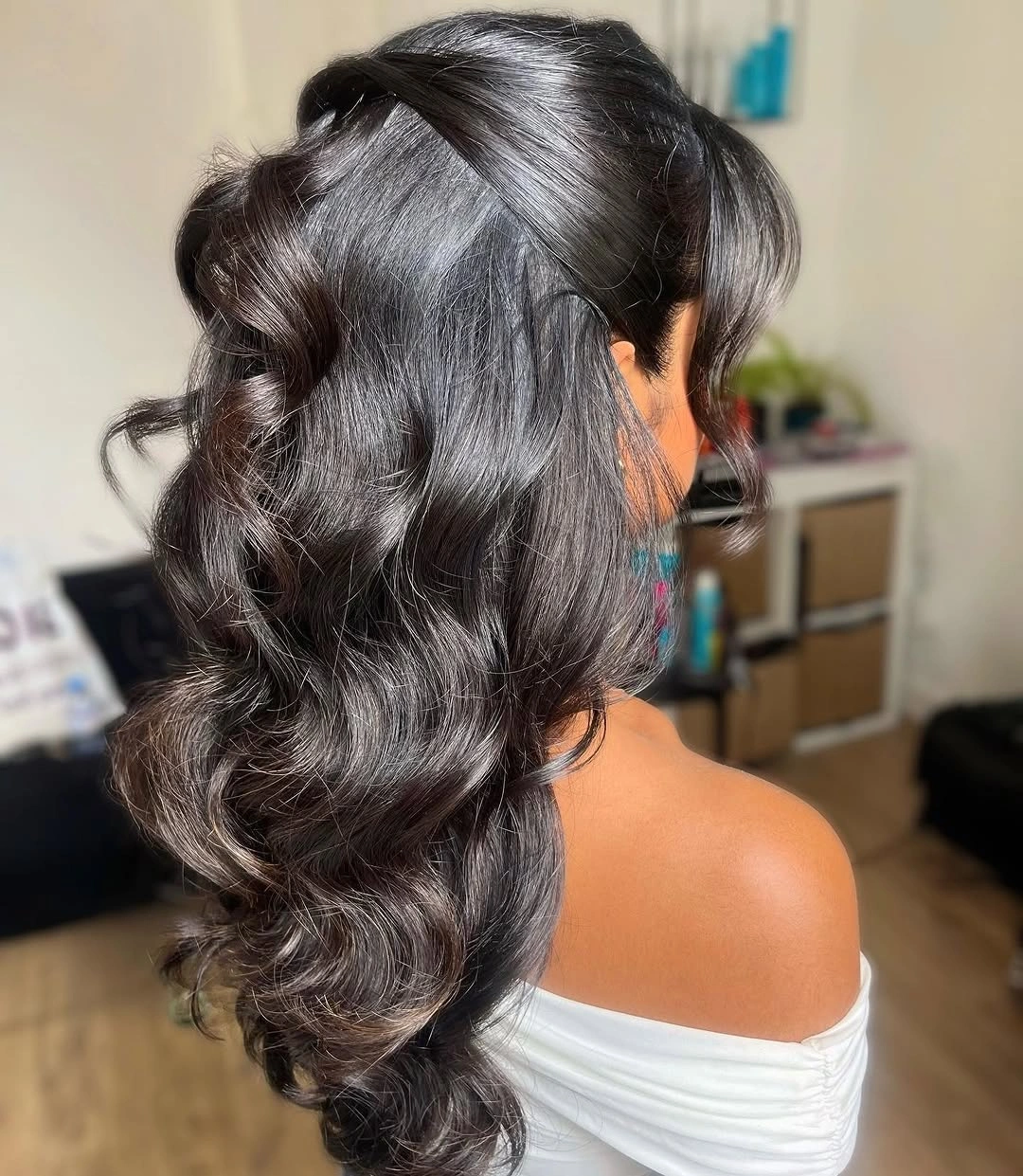 fall hairstyles for wedding guests 2026 Glossy Black Half-Up Waves With An Off-Shoulder Neckline