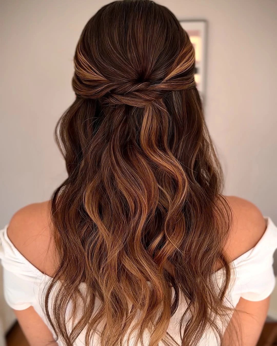 fall hairstyles for wedding guests 2026 Caramel Brunette Half-Up Waves With Soft Off-Shoulder Romance