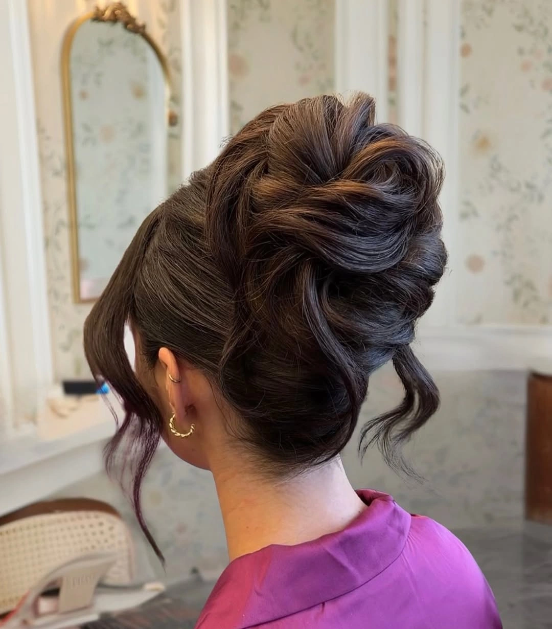 fall hairstyles for wedding guests 2026 Voluminous Chocolate Bun With Satin Evening Energy