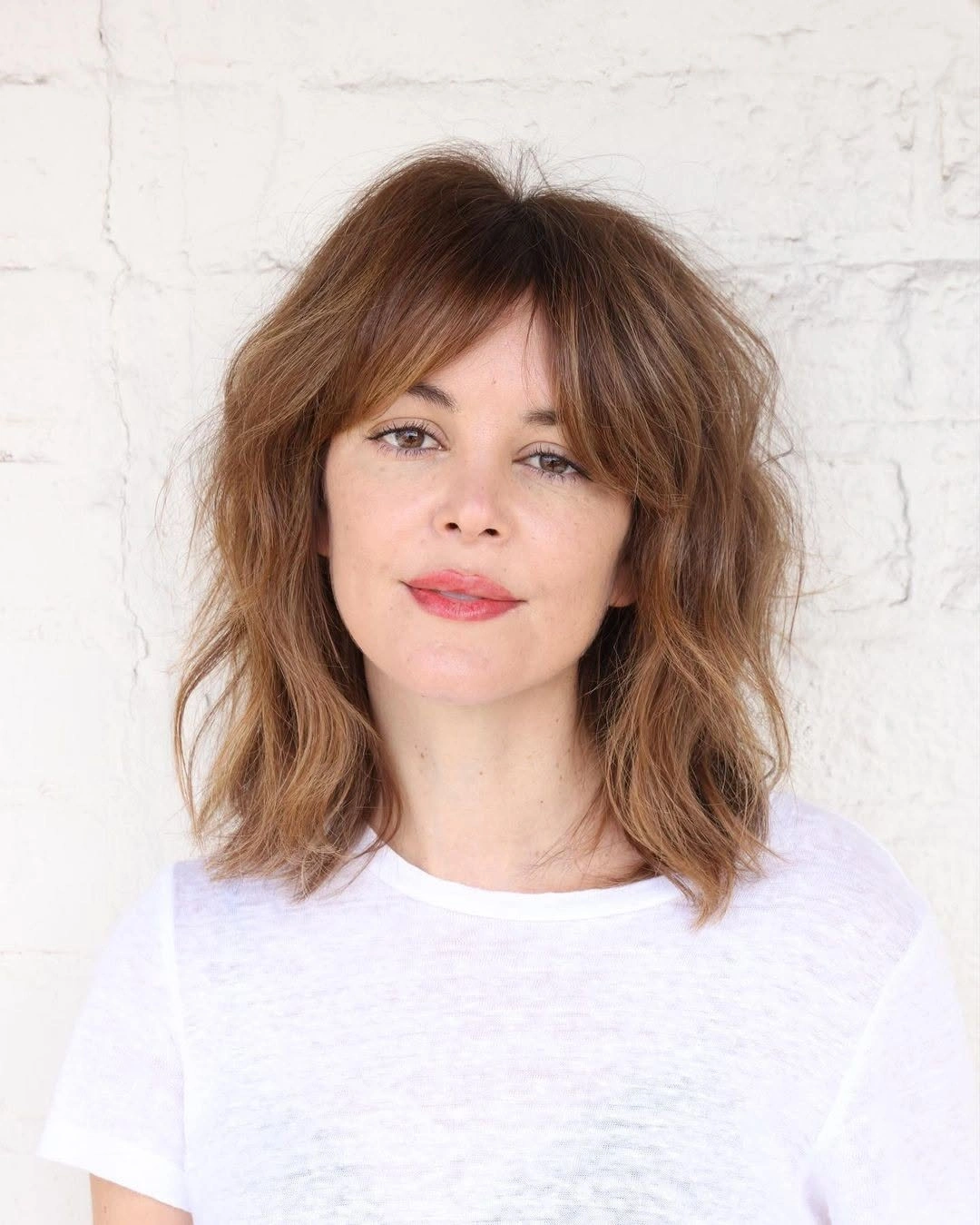 fall medium haircuts 2026 Textured French-Girl Lob With Soft Bangs