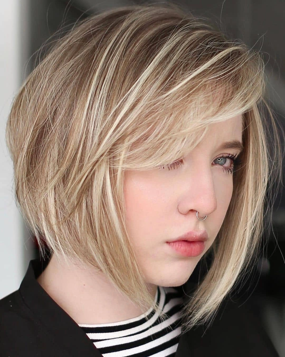 fall medium haircuts 2026 Asymmetrical Blonde Bob With Side-Swept Texture