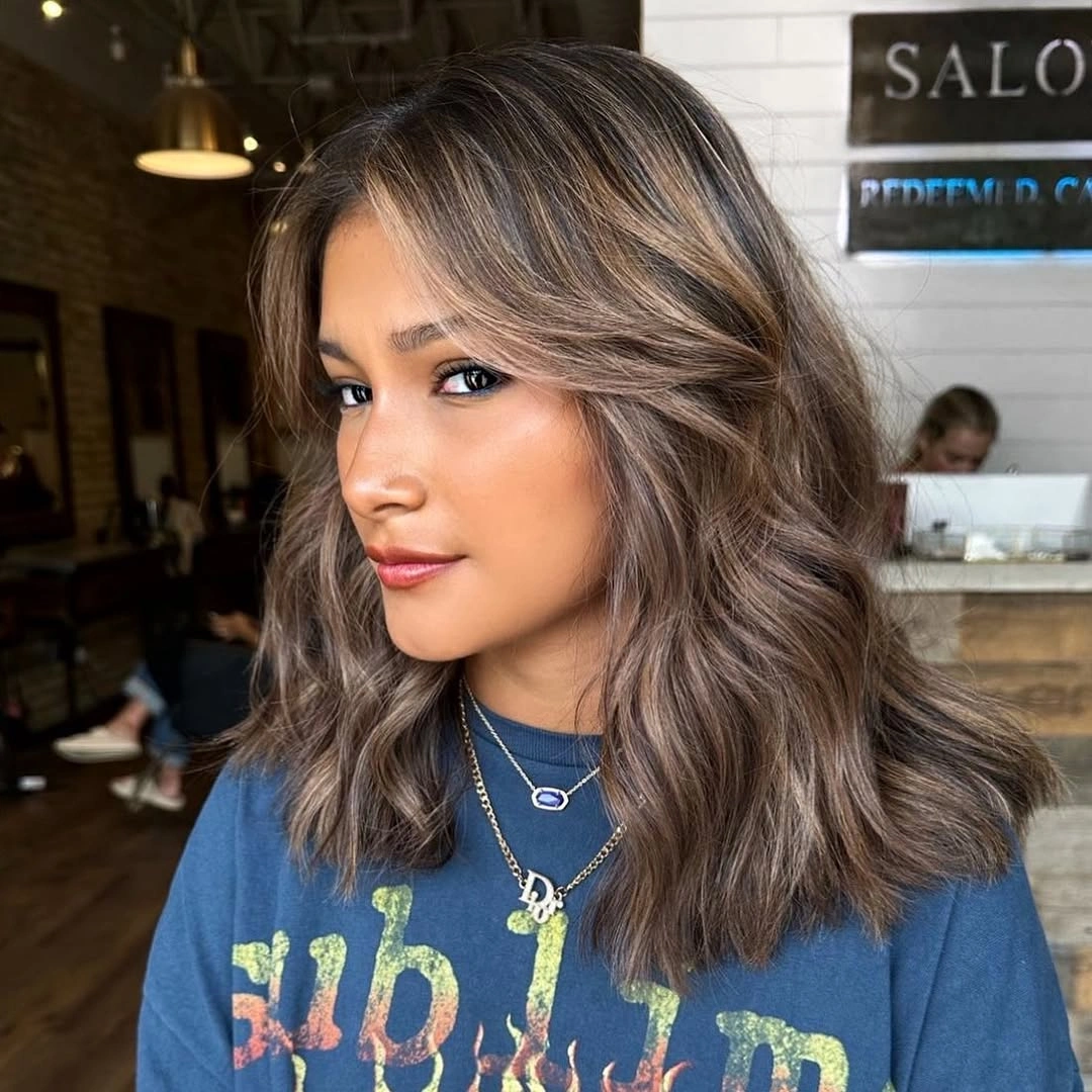 fall medium haircuts 2026 Textured Medium Waves With Smoky Brunette Color