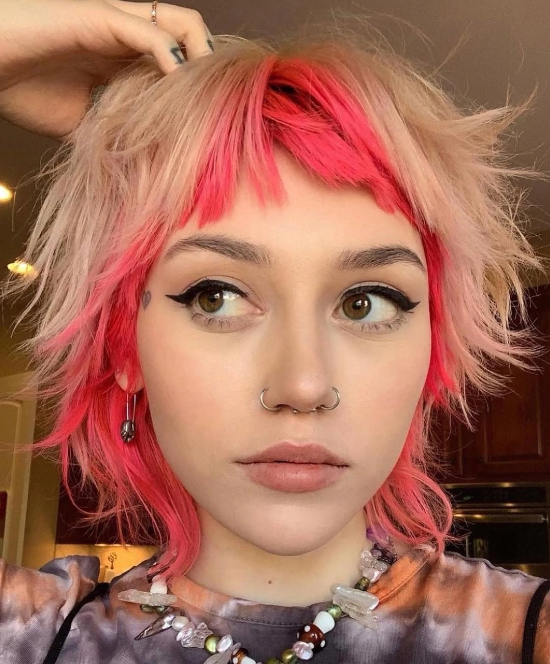 fall medium haircuts 2026 Pink Shaggy Layers With Rebel-Girl Bangs