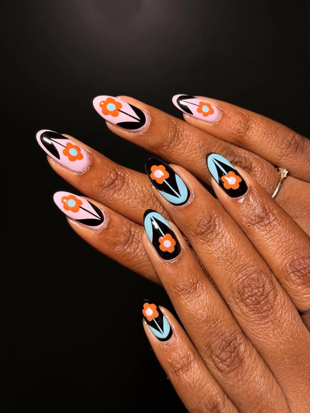 fall medium nail ideas 2026 Black Medium Nails With Orange Flower Graphics