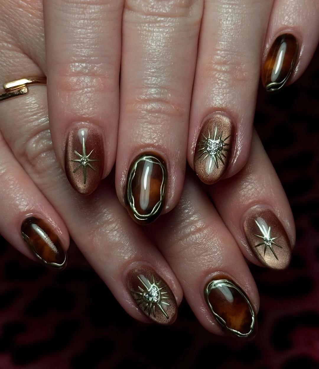 fall nail art 2026 Amber Brown Nails With Starburst Gold Details