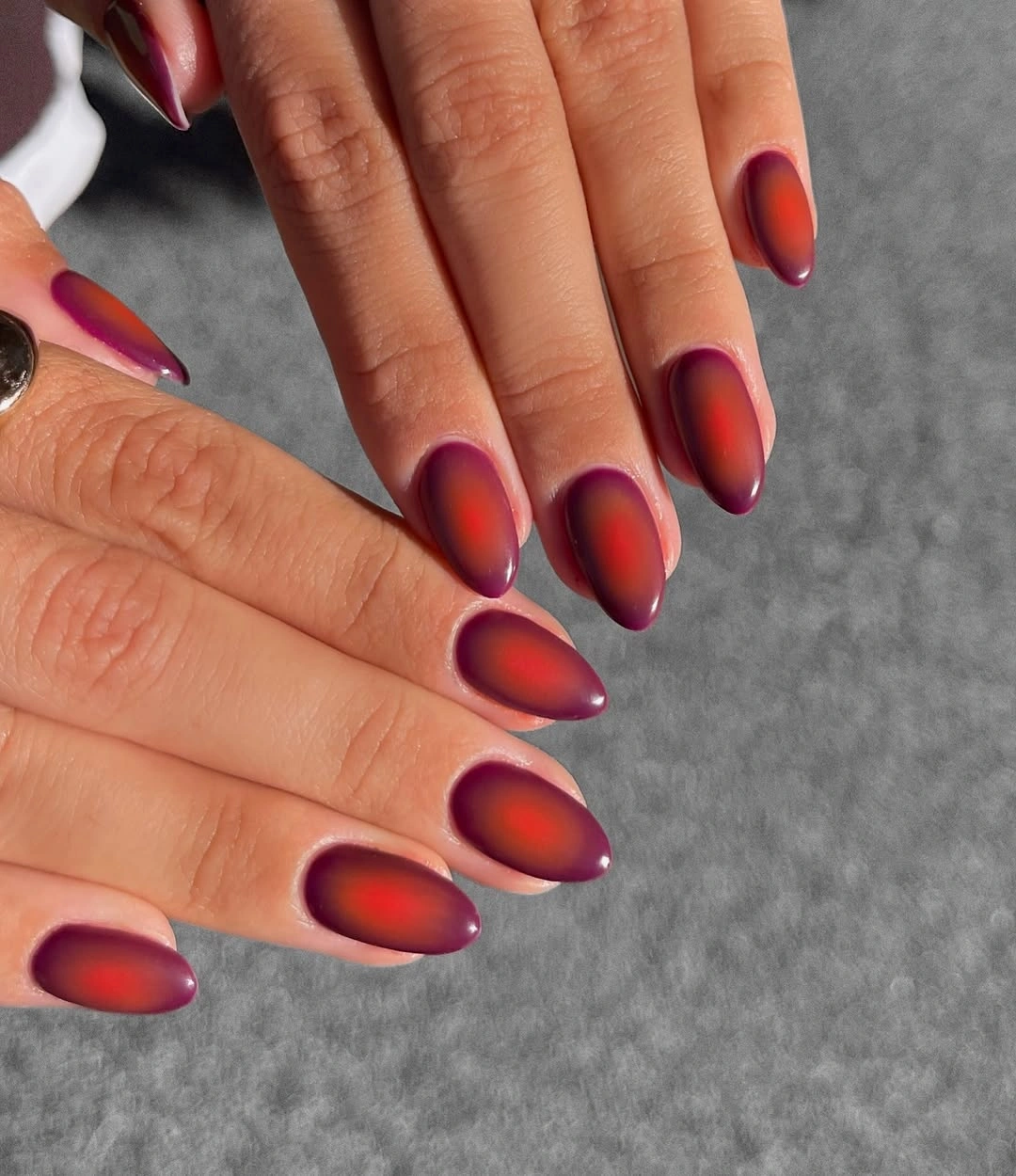 fall nail art 2026 Burgundy Aura Nails With Soft Orange Centers