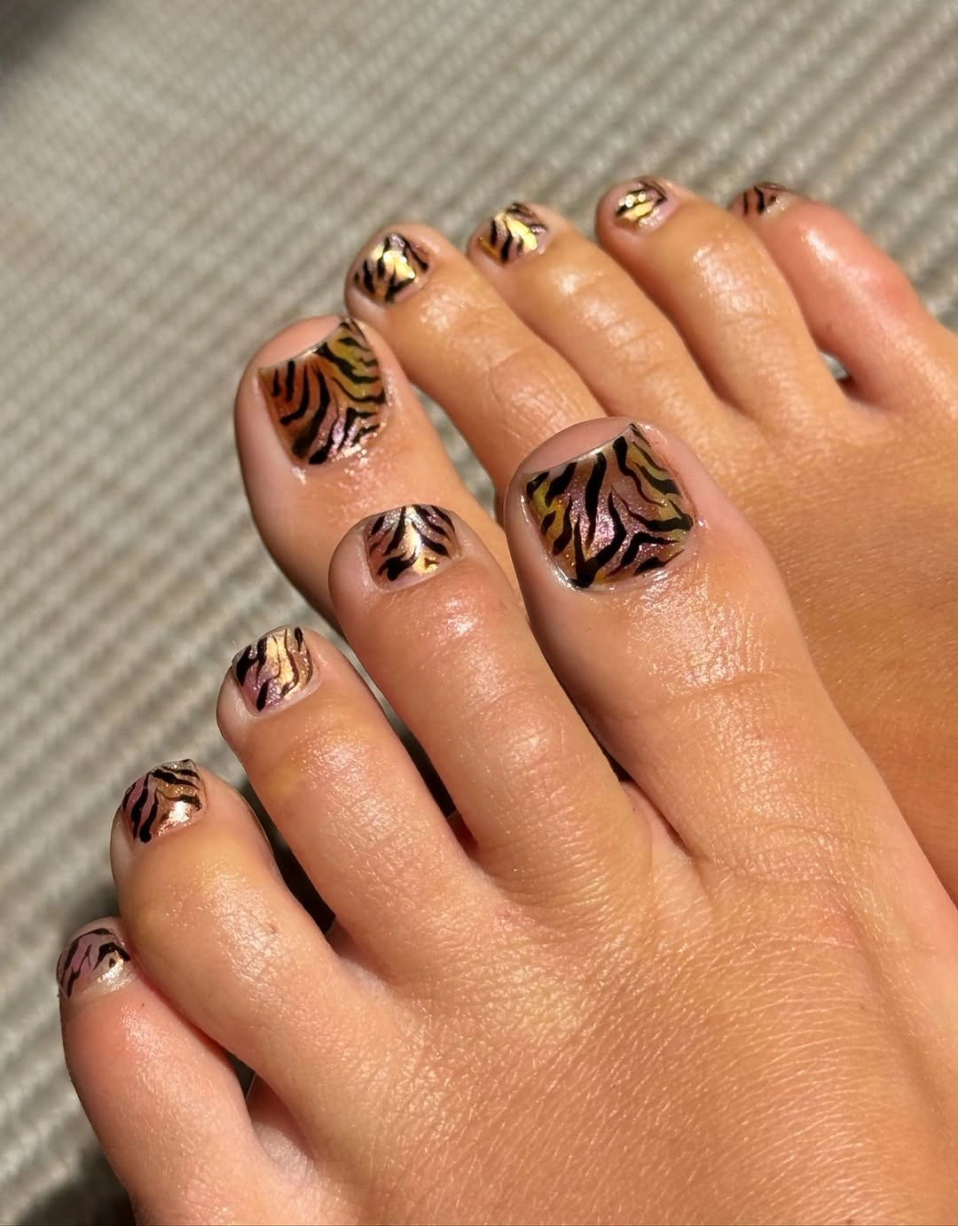 fall pedicure ideas 2026 Tiger Stripe Pedicure With Warm Brown Base