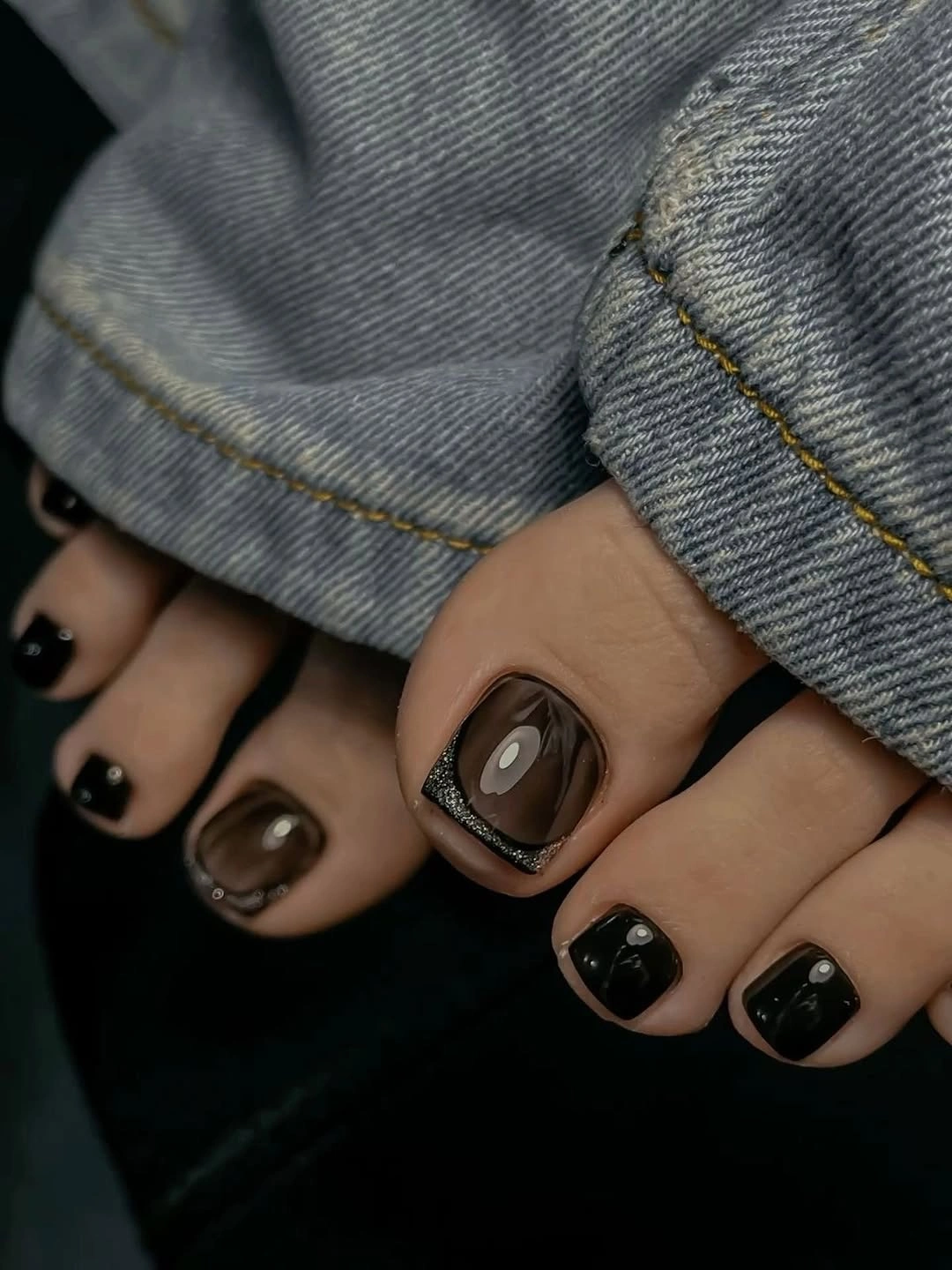 fall pedicure ideas 2026 Black Brown Pedicure With Silver Ring Accent