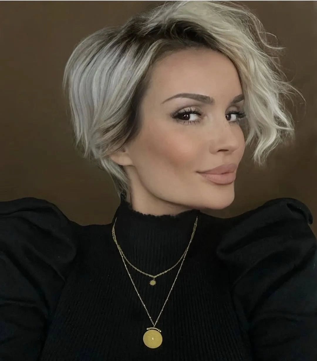 fall pixie haircut ideas 2026 Asymmetrical Silver Pixie Bob With Side-Swept Volume