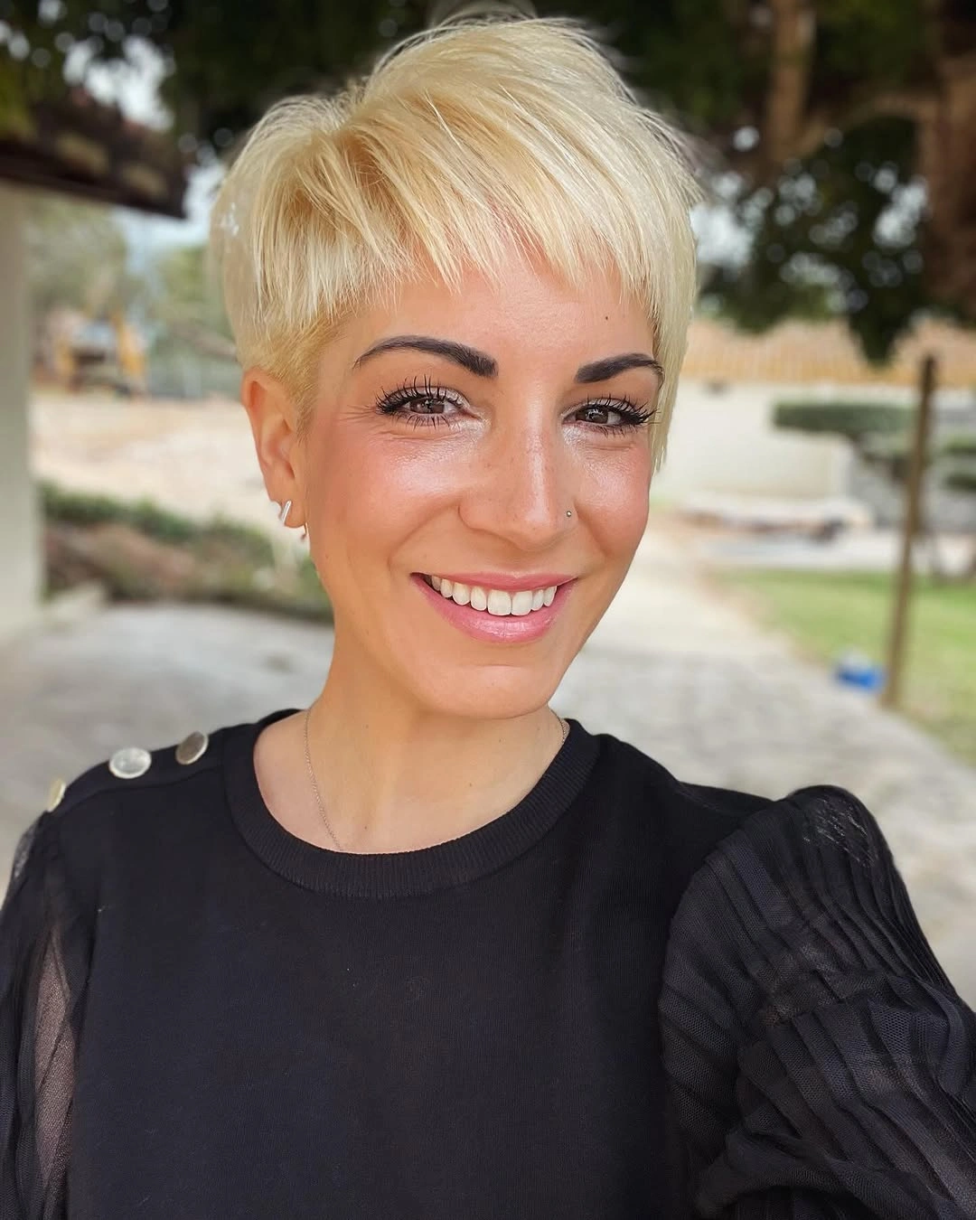 fall pixie haircut ideas 2026 Buttery Blonde Pixie With a Soft Straight Fringe
