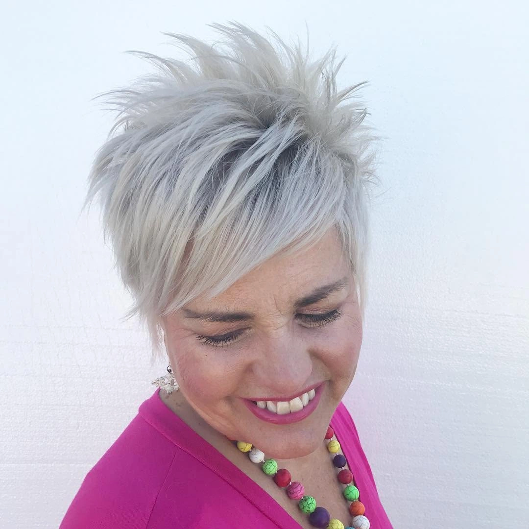 fall pixie haircut ideas 2026 Spiky Silver Pixie With a Sweeping Side Fringe