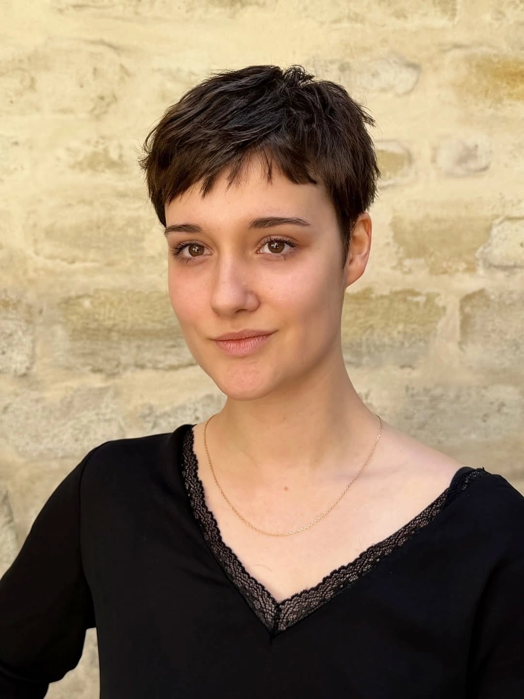 fall pixie haircut ideas 2026 Dark Tousled Pixie With Piecey Micro Bangs