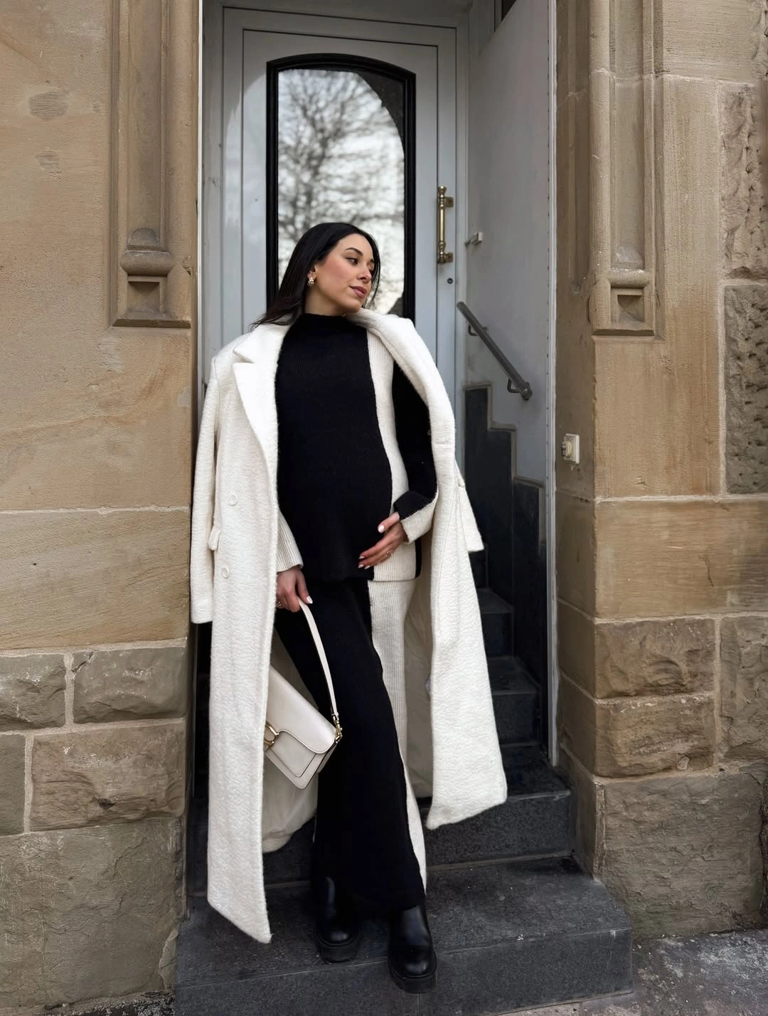 fall pregnancy outfits 2026 + Black Knit Layers With a White Statement Coat