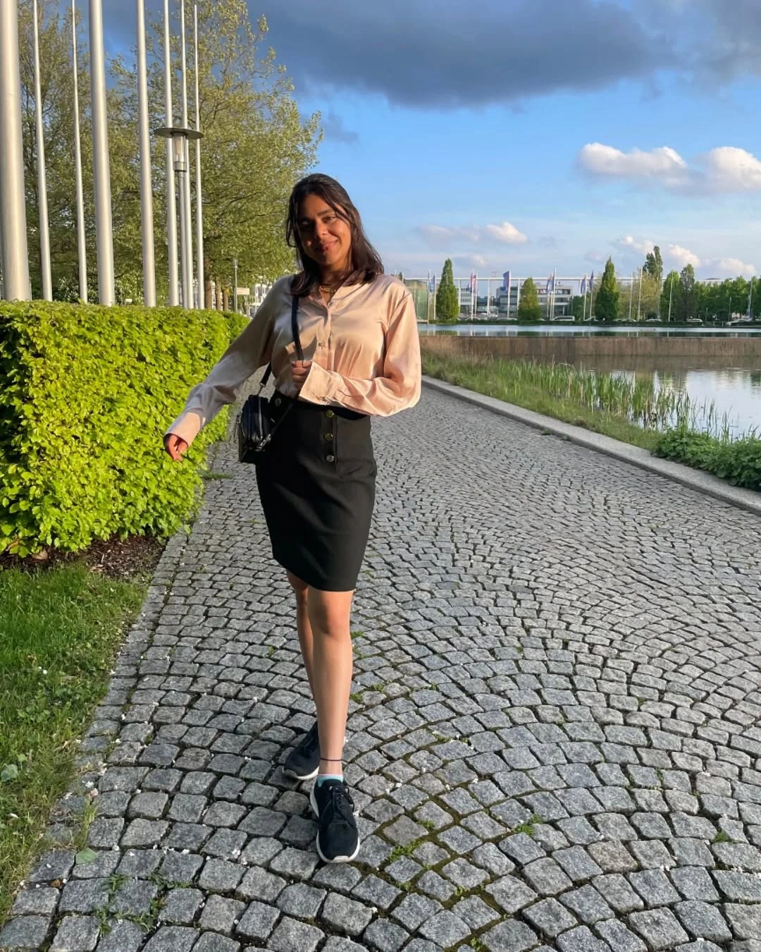 fall professional outfits women 2026 Silk Blouse and Pencil Skirt with Sneakers for a Modern Hybrid Office
