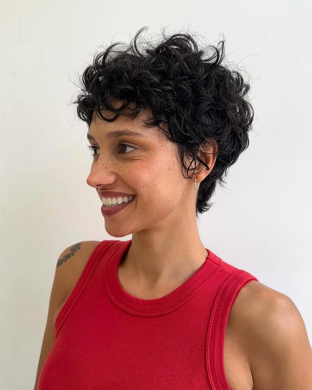 fall short haircuts 2026 + Curly Cropped Cut With Bright Red Energy