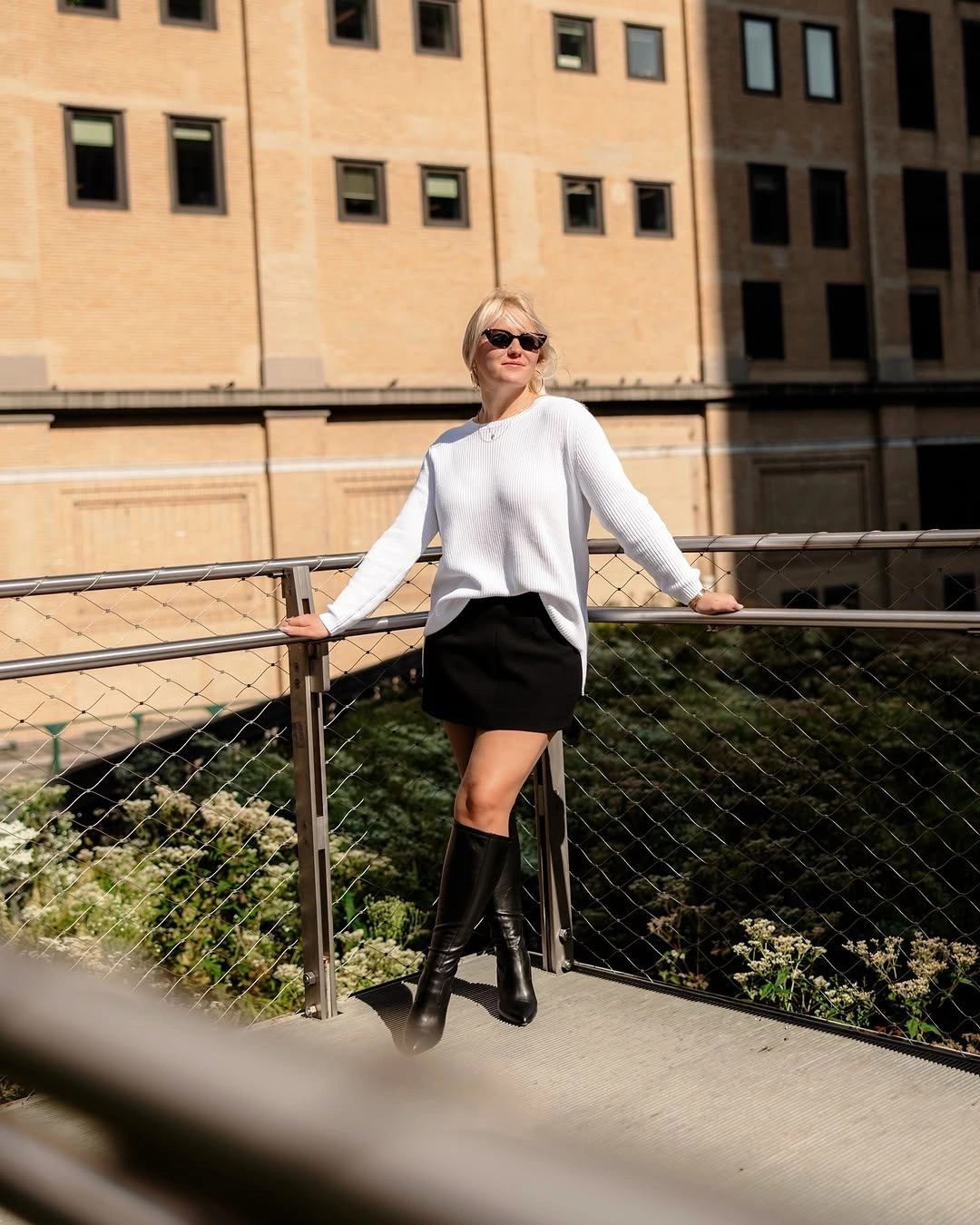 fall sweater dress outfits 2026 + White Ribbed Sweater With a Black Mini and Tall Boots