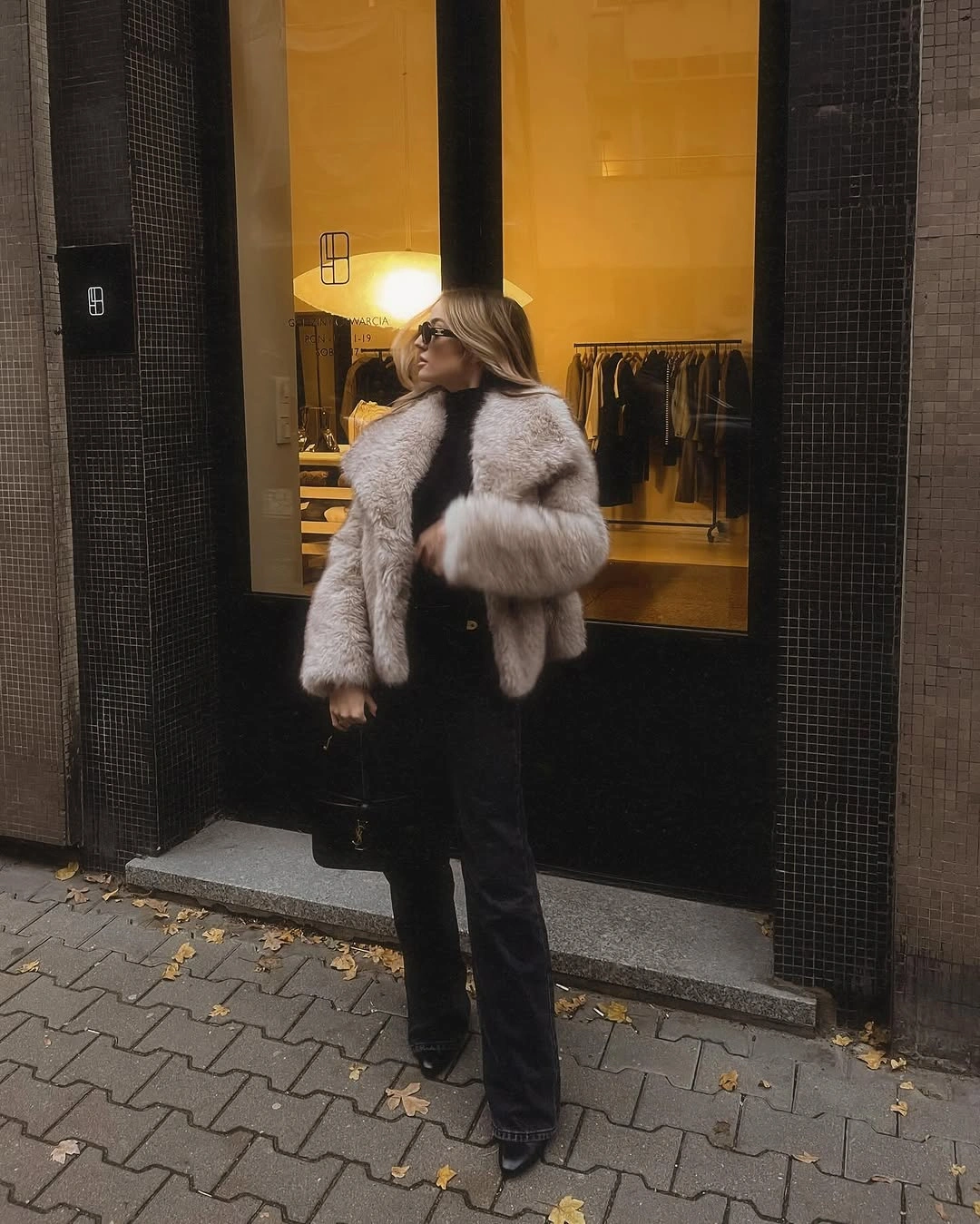 faux fur jacket Pale Gray Jacket Over a Sleek Black Column
