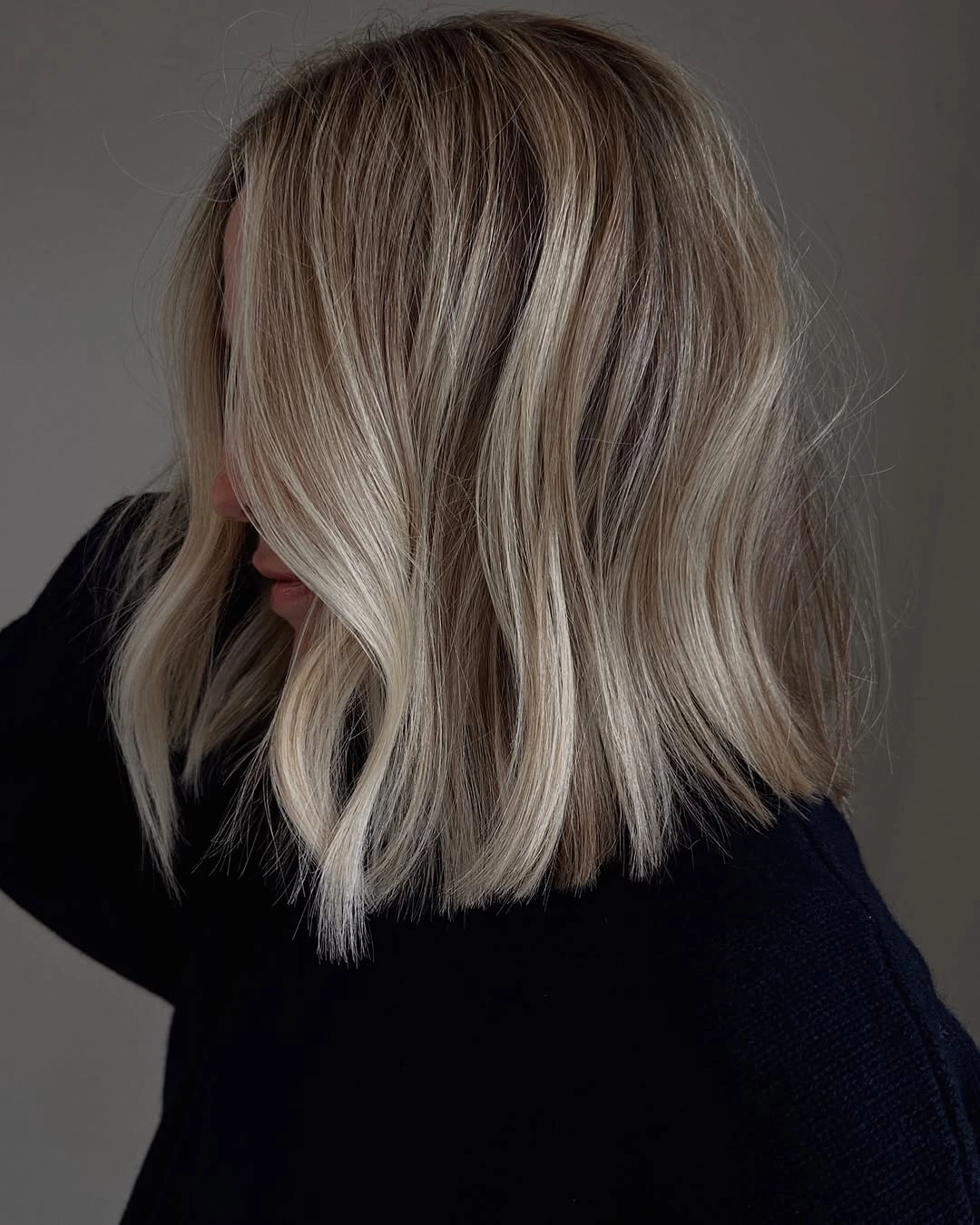hair lowlights color ideas and inspiration Icy Blonde Lob With Charcoal-Beige Lowlights